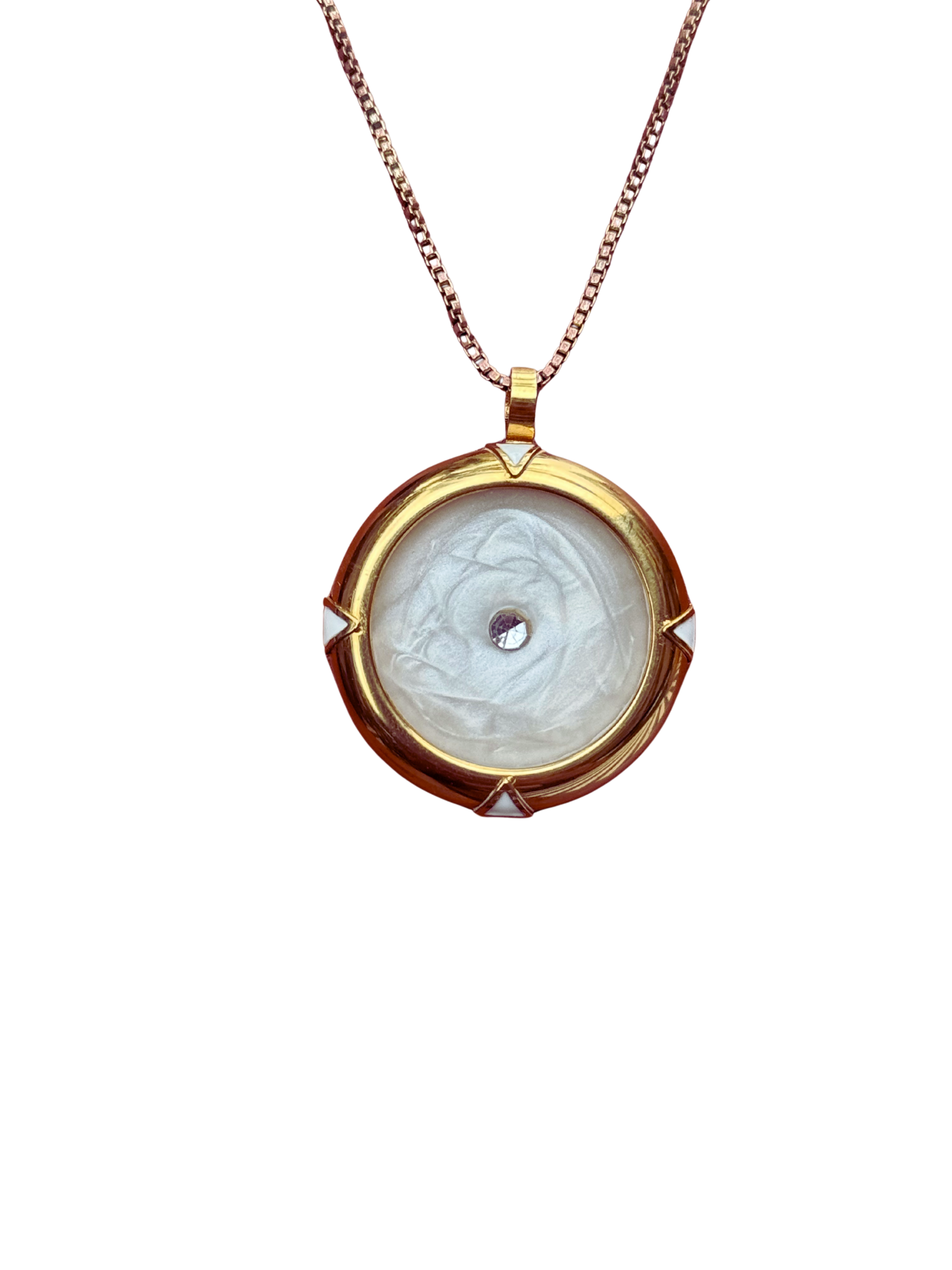 Gold pendant necklace with a white stone on a white background